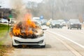 Burning car on fire on a highway road accident Royalty Free Stock Photo