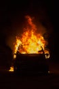 Burning car on the road in the night Royalty Free Stock Photo
