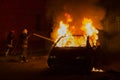 Burning car on the road in the night Royalty Free Stock Photo