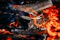 Burning charcoal embers firewood with ashes and flames Royalty Free Stock Photo