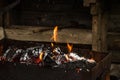Burning charcoal in a fireplace. burning wood burning in a fireplace. Fire in the grill at the camping close-up. Royalty Free Stock Photo