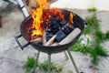 Burning charcoal and wood in barbecue grill outside Royalty Free Stock Photo