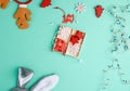 Burning christmas garland on a white wire with colorful lights and box with wooden toys for the Christmas tree Royalty Free Stock Photo