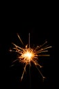 Burning christmas sparkler isolated on black background. Royalty Free Stock Photo