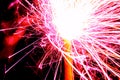 Burning christmas sparklers with long exposure. Beautiful sparkler firework flame on black background. Blurred lights of firework. Royalty Free Stock Photo