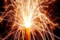 Burning christmas sparklers with long exposure. Beautiful sparkler firework flame on black background. Blurred lights of firework. Royalty Free Stock Photo