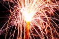 Burning christmas sparklers with long exposure. Beautiful sparkler firework flame on black background. Blurred lights of firework. Royalty Free Stock Photo