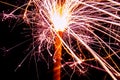 Burning christmas sparklers with long exposure. Beautiful sparkler firework flame on black background. Blurred lights of firework. Royalty Free Stock Photo