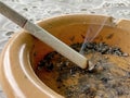 A Burning Cigarette on an Ashtray Royalty Free Stock Photo