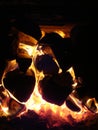 Burning coals with logs of firewood lying in the Russian stove Royalty Free Stock Photo