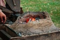 Burning coals in medieval furnace