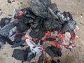 Burning coals, wood and ashes in the hot oven