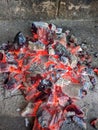 Burning coals, wood and ashes in the hot oven