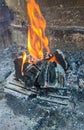Burning coals, wood and ashes in the hot oven Royalty Free Stock Photo