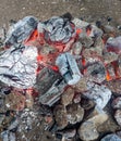 Burning coals, wood and ashes in the hot oven