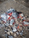 Burning coals, wood and ashes in the hot oven