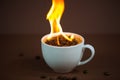 Burning coffee beans in a coffee cup