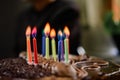 Burning colored candles on a holiday cake, the child`s tenth anniversary Royalty Free Stock Photo