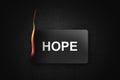 burning credit card hope on black background Royalty Free Stock Photo
