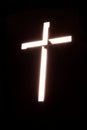 Burning cross on black background church