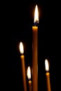 Burning in the dark taper candles Royalty Free Stock Photo