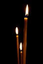 Burning in the dark taper candles Royalty Free Stock Photo