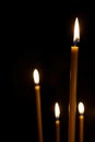 Burning in the dark taper candles Royalty Free Stock Photo