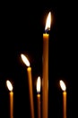 Burning in the dark taper candles. the fire burning in the darkness Royalty Free Stock Photo