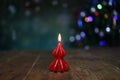Burning decorative candle on christmas background