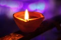 Burning diya oil lamps, Lit diya lamp on street at night or beautiful diwali lighting, selective focus. Royalty Free Stock Photo