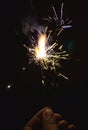 burning electric sparklers for diwali celebration during night time in india