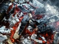 Burning embers of a campfire, black and white red abstract background