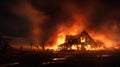 Burning farm house on a fire field, expansion of the fire area