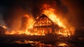 Burning farm house on a fire field, expansion of the fire area Royalty Free Stock Photo