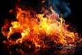 Burning fire close up bright orange and red flames on a dark background Royalty Free Stock Photo