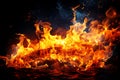 Burning fire close up bright orange and red flames on a dark background Royalty Free Stock Photo