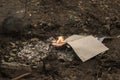 Burning in the fire of a torn notebook. The cover and the multi-colored sheets burn into gray ash Royalty Free Stock Photo