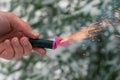 Burning Firecracker in a Hand. Sparks and Smoke of Petard Royalty Free Stock Photo