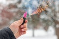 Burning Firecracker in a Hand. Sparks and Smoke of Petard Royalty Free Stock Photo