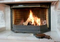 Burning fireplace and bellows Royalty Free Stock Photo