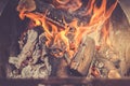 Burning firewood in barbecue/burning brazier with firewood
