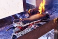 burning firewood in the barbecue grill