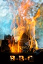 Burning firewood in a brazier in the garden, fire flames outdoors Royalty Free Stock Photo