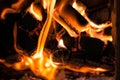 Burning firewood close-up. The fire burns in the stove. Photograph of fire