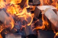 Burning firewood in the fireplace closeup, glowing logs, fire and flames Royalty Free Stock Photo