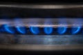 The burning blue flame of a gas ring in kitchen Royalty Free Stock Photo