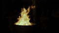 Burning flame at the metal barrel. Clip. Close up of burning fire flame, concept of homeless life. Royalty Free Stock Photo