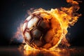burning football soccer ball on fire is flying on black isolated background. Sport burn element concept Royalty Free Stock Photo