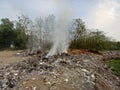 Burning trash in landfills