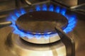 Burning gas burner on home kitchen stove. Royalty Free Stock Photo